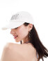 Weekday cap with silver embroidery in white