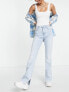 Stradivarius Tall stretch flare jean with split detail in light blue