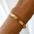 Фото #4 товара A charming gold-plated solid bracelet with crystals