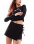 COLLUSION low rise wrap skort with tie detail in black