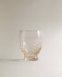 Raised design glass tumbler