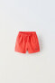 Plush bermuda shorts with label detail