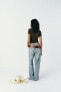 Trf wide-leg mid-rise deconstructed jeans