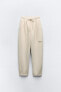 Plush cocoon jogger trousers with raised slogan