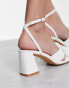 Glamorous mid heel sandals with bow in white