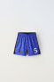 Sporty football bermuda shorts