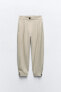 Carrot-fit trousers with cuffed hems