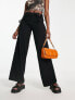 Neon & Nylon low waisted trousers with cut out detail in black