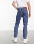 Фото #2 товара HUGO 634 distressed knees tapered fit jeans in mid blue