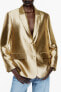 Gold blazer with padded shoulders
