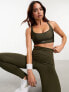 Фото #7 товара Puma Running Evolve medium support sports bra in khaki