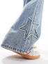 Stradivarius STR wide leg jean with star patch in medium blue