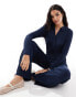 Vero Moda collared button front jersey jumpsuit in mid blue