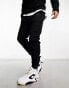 Фото #1 товара Nike Tech Fleece joggers in black