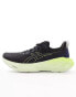 Asics Novablast 4 running trainers in black and neon yellow