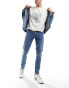 Фото #2 товара ASOS DESIGN skinny jeans in mid wash blue