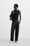 RELAXED FIT PLEATED TROUSERS