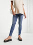 Фото #7 товара ASOS DESIGN Maternity ultimate skinny jeans in authentic mid blue with under the bump waistband