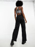 Фото #5 товара Nike mini swoosh high rise woven trousers in black