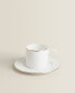 Rimmed bone china teacup and saucer