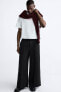 Trousers with contrast double waist