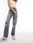 Topshop mid rise straight Dad jeans with extreme rip & repair in mid blue