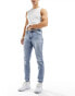 ASOS DESIGN slim jeans in mid wash blue