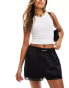 COLLUSION lace hem satin boxer short in black