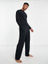 Фото #3 товара ASOS DESIGN pyjama set with long sleeve turtle neck top with tie back and trousers in black