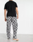 ASOS DESIGN pyjama set with t-shirt and trousers in black with fleece printed bottom Черный, S - W32 - фото #2