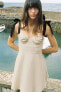 Фото #1 товара Мини-платье из смесового льна с контрастными бантами ZARA