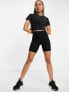 Фото #7 товара Nike Training One Luxe Dri-FIT wrap cropped top in black