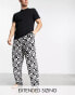 Фото #2 товара ASOS DESIGN pyjama set with t-shirt and trousers in black with fleece printed bottom