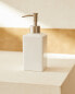 White earthenware bathroom soap dispenser