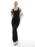 Фото #1 товара In The Style ribbed scoop neck flared jumpsuit in black