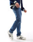 Фото #12 товара Levi's 502 taper fit jeans in mid blue