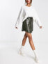 Фото #4 товара ASOS DESIGN faux leather button through mini skirt with belt in khaki