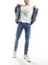 Фото #1 товара ASOS DESIGN skinny jeans in mid wash blue