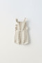 Ruffled knit romper suit