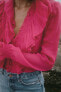Semi-sheer blouse with ruffle trims