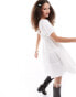 Фото #4 товара Monki textured babydoll mini dress with tiered hem and puff sleeves in white