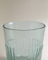 Raised design glass tumbler