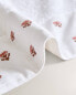 Towel with embroidered floral border