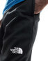 The North Face Training Reaxion fleece joggers in black