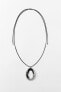 Cord necklace with circular pendant