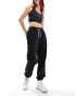 Фото #8 товара Tommy Jeans relaxed script joggers in black