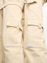 Calvin Klein Jeans unisex cargo joggers in beige - exclusive to ASOS