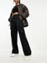 Фото #1 товара Ellesse Sanzan cargo pants in dark black