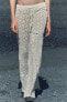Knit trousers with side lace