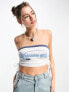 Фото #1 товара Tammy Girl graphic bandeau crop top with ruched tie sides in white